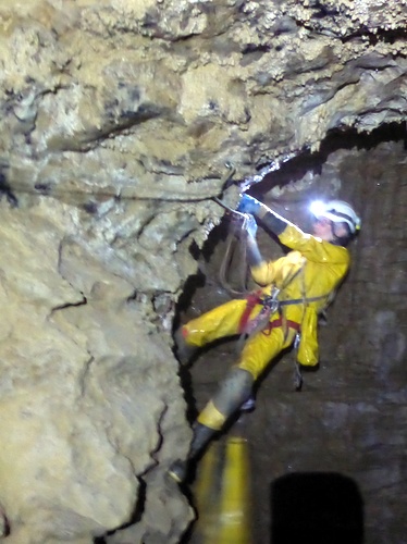 A caver on the traverse between Trou du Glaz and Grotte Chevalier, Dent de Crolles